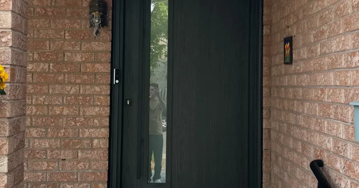 Front entry door on a home in Vaughan, Ontario — winter latch adjustment